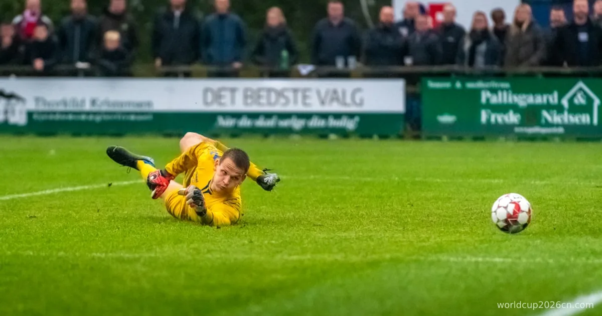 man in yellow jacket playing soccer during daytime